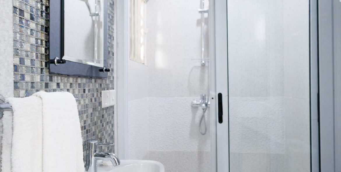 Private bathroom with shower and window