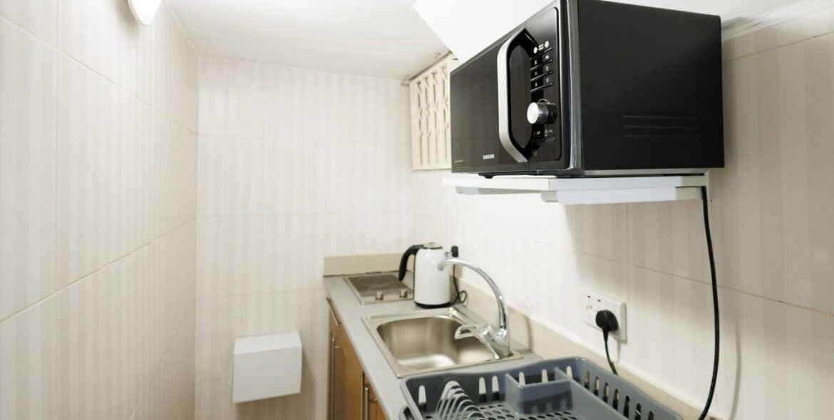Kitchenette with microwave and refrigerator
