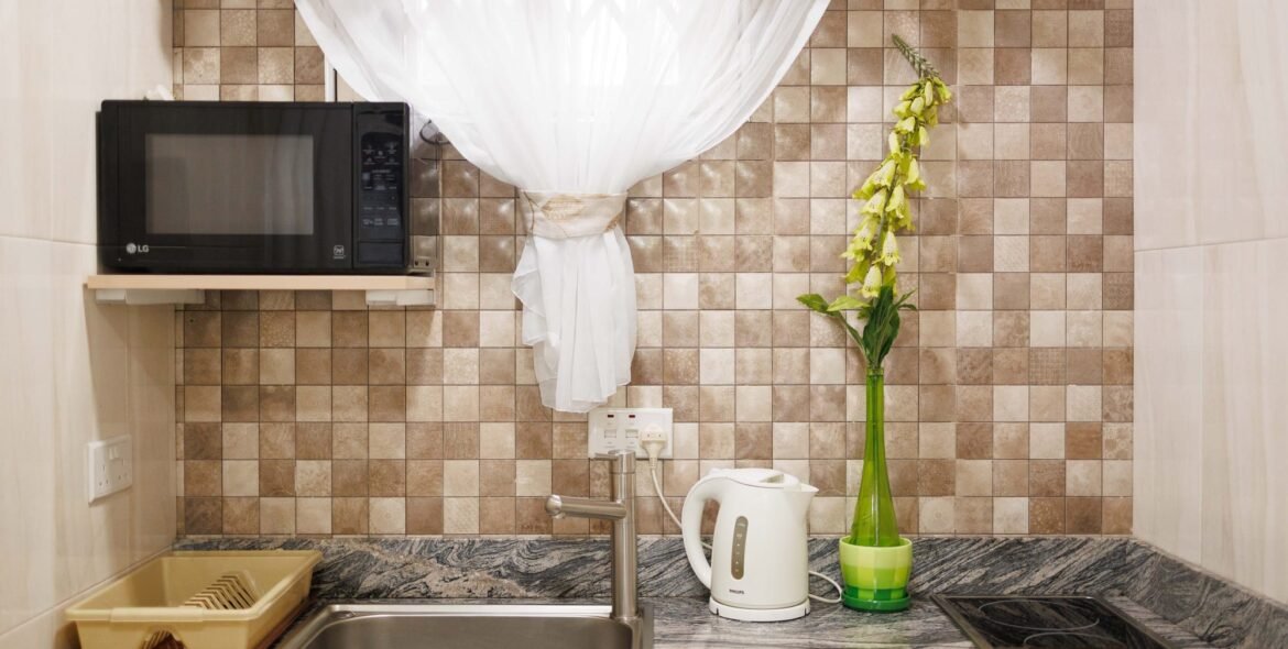 Sink and window in a queen-room kitchenette