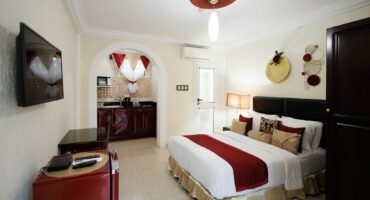 Standard Double Room with a double bed, seating and kitchenette at The Ritzz Exclusive in Osu