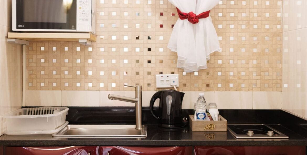 Standard Double Room kitchenette with window and microwave