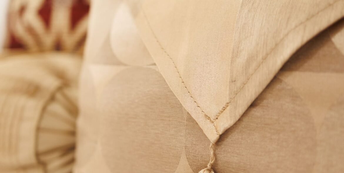 Cream and patterned cushions on the Standard Double Room bed